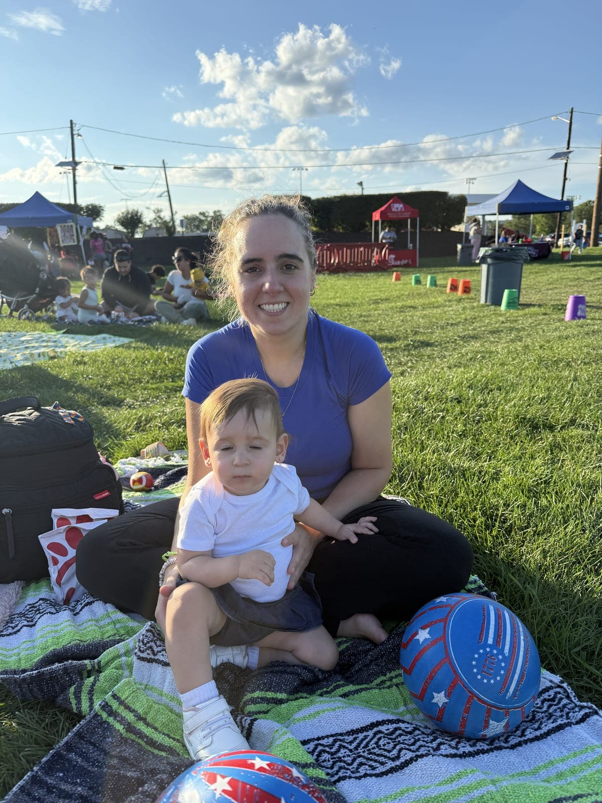 Families spread out across the field as Union's community movie night gets underway.
