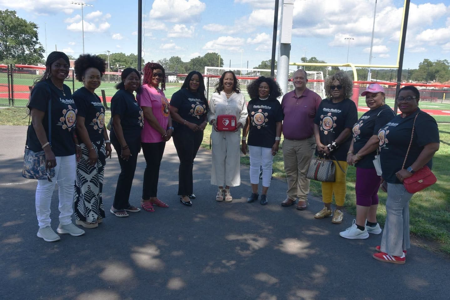 Members of Ifeatu-Ifediche Anambra Women of New Jersey present the Township of Union Recreation Department with an automated external defibrillator.